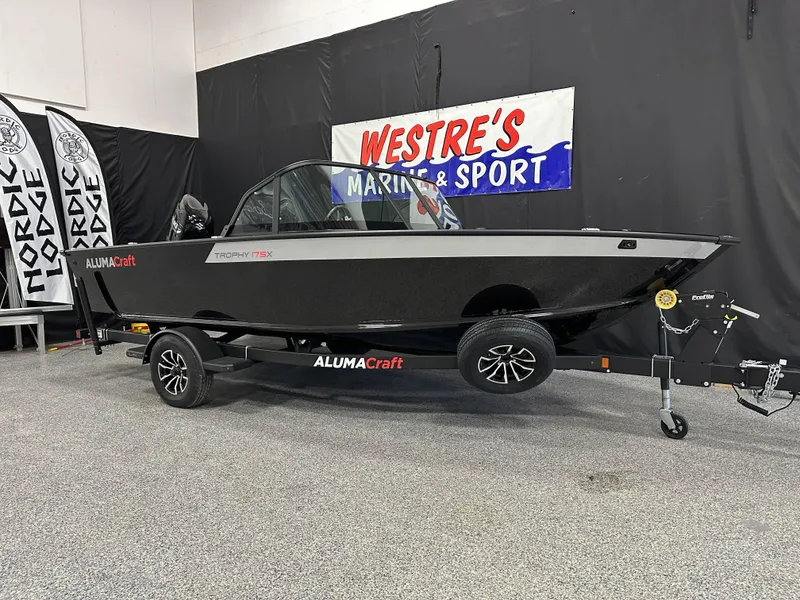 The Image of 2025 Alumacraft Trophy 175X Sport boat on trailer at Westre's Marine & Sport showroom. - 0
