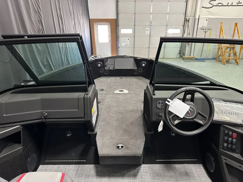 Slide: The Image of 2025 Alumacraft Trophy 175X Sport boat interior with dual seats and steering console. - 11