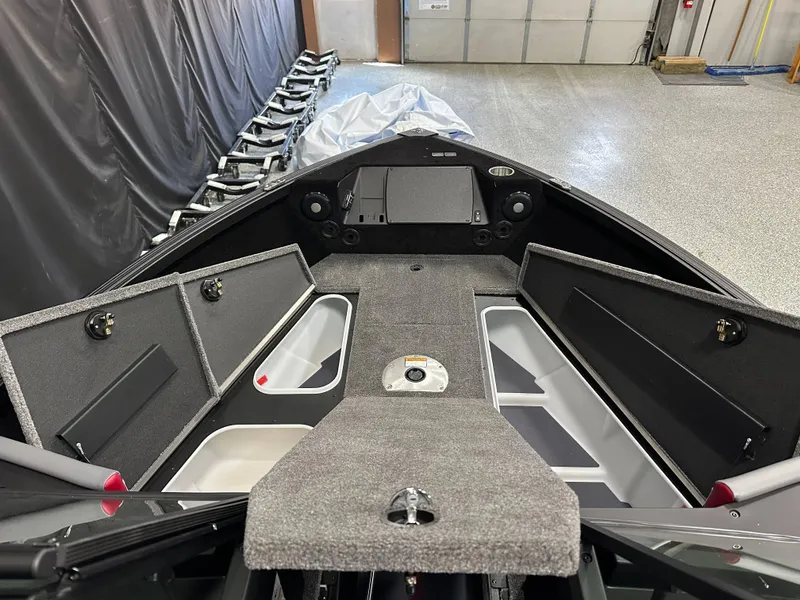 Slide: The Image of 2025 Alumacraft Trophy 175X Sport interior with gray and red seating, modern dashboard. - 14