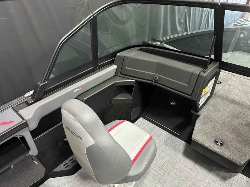 Slide: The Image of Glove compartment of 2025 Alumacraft Trophy 175X Sport boat with documents inside. - 15