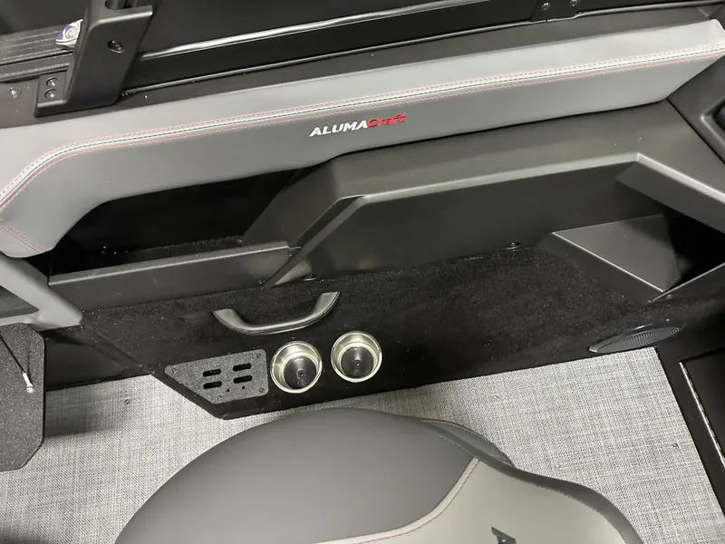 Slide: The Image of 2025 Alumacraft Trophy 175X Sport boat interior with steering wheel and seat. - 17