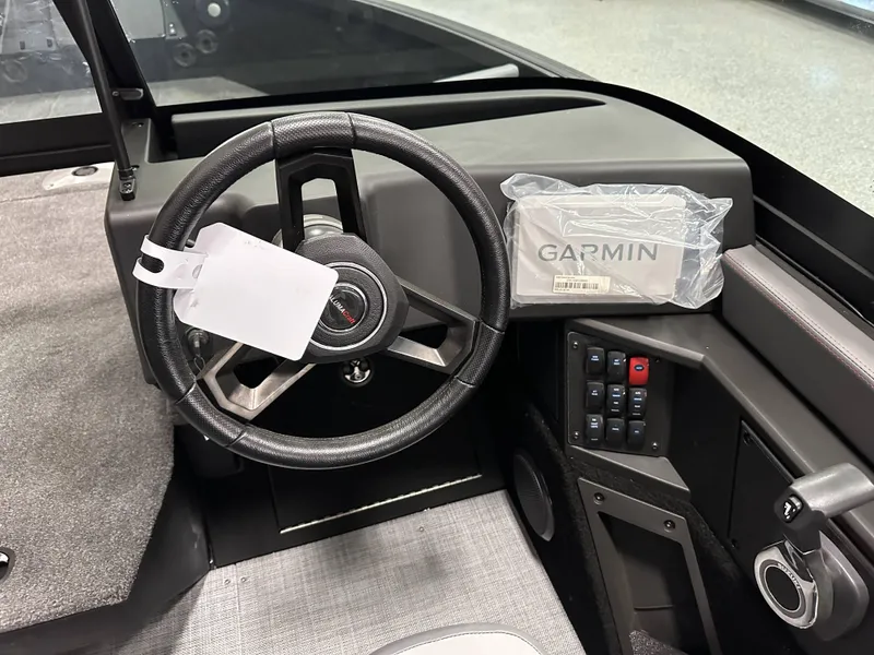 Slide: The Image of 2025 Alumacraft Trophy 175X Sport dashboard with controls and red safety cord. - 20