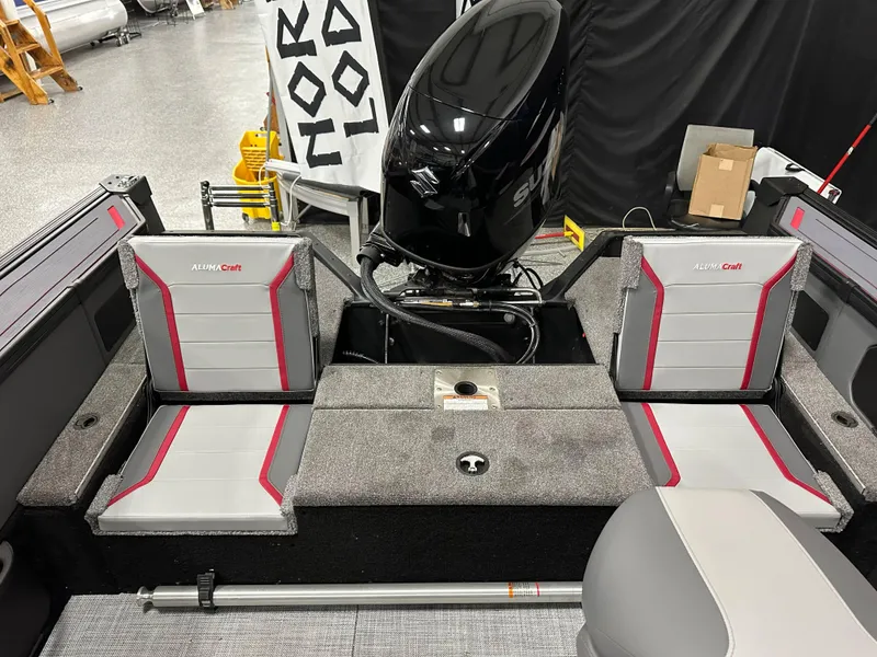 Slide: The Image of 2025 Alumacraft Trophy 175X Sport interior with seating and storage compartment. - 26