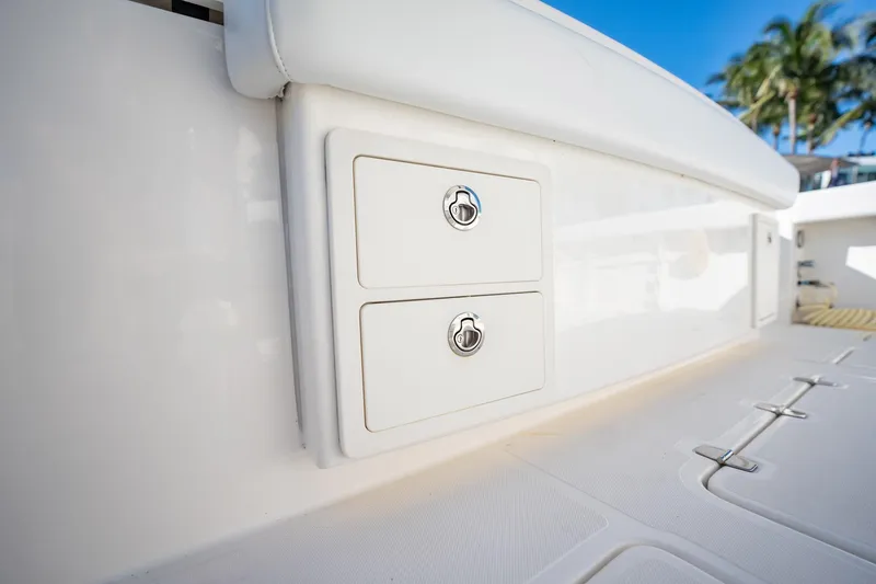 Slide: The Image of 2020 Pursuit S 408 Sport boat storage compartments with lockable drawers. - 26
