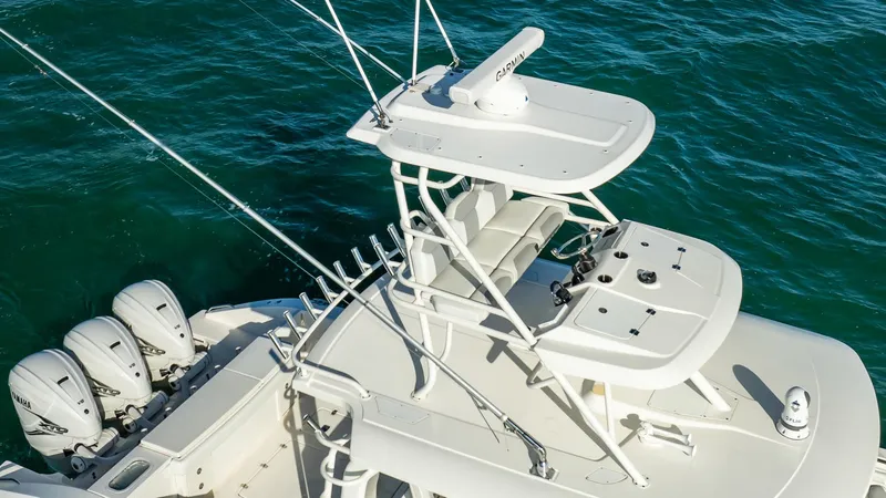 Slide: The Image of 2020 Pursuit S 408 Sport boat with multiple outboard engines on blue water. - 37