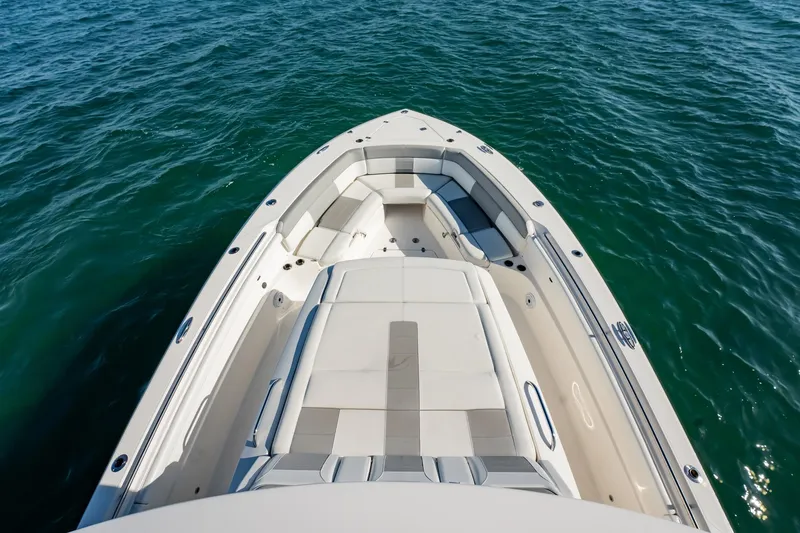 Slide: The Image of 2020 Pursuit S 408 Sport boat on clear blue water, top view. - 38