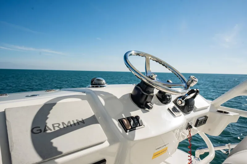 Slide: The Image of Helm of 2020 Pursuit S 408 Sport boat with Garmin equipment, ocean view. - 42