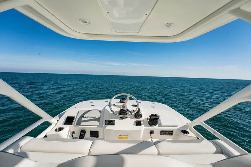 Slide: The Image of 2020 Pursuit S 408 Sport boat helm with ocean view. - 44