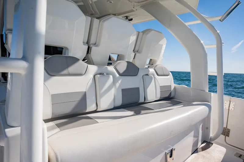 Slide: The Image of 2020 Pursuit S 408 Sport boat interior seating with ocean view. - 49