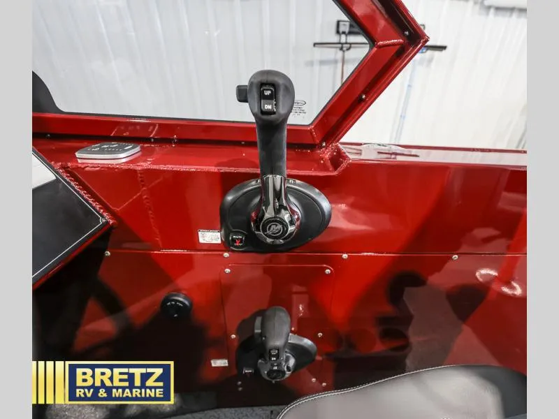 Slide: The Image of Control panel of a 2025 Evolution 221 boat, featuring throttle and trim controls. - 13