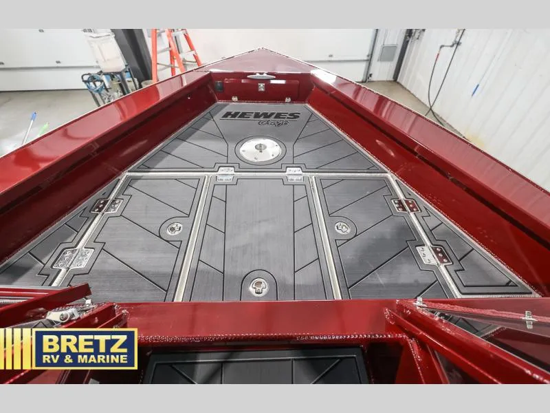 Slide: The Image of Red Evolution 221 boat deck, 2025 model, displayed at Bretz RV & Marine showroom. - 18