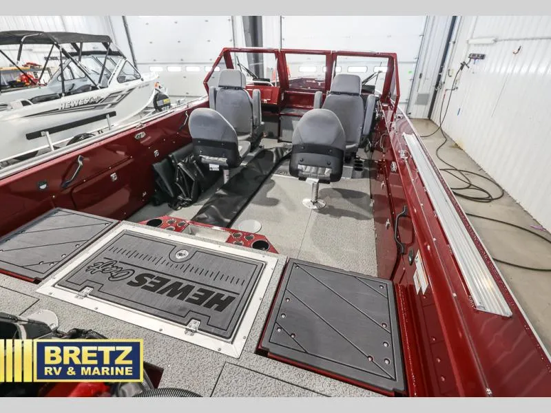 Slide: The Image of Interior of a 2025 Evolution 221 boat with seating, showcased at Bretz RV & Marine. - 19