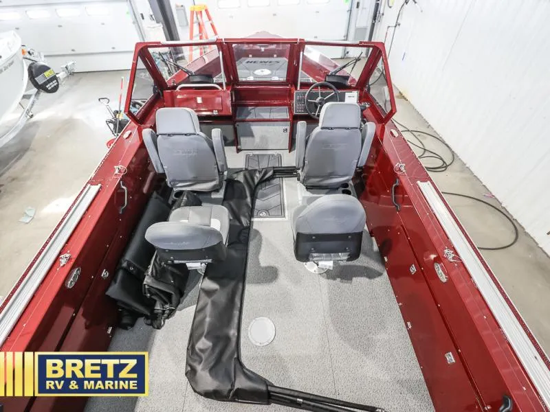 Slide: The Image of Interior of a 2025 Evolution 221 boat with four seats and red dashboard. - 20