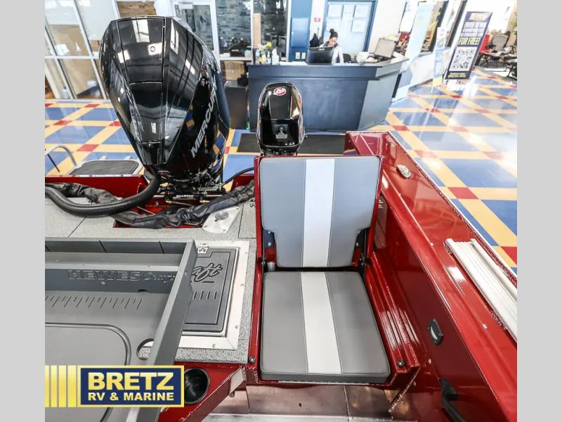Slide: The Image of 2025 Evolution 221 boat interior with Mercury engine at Bretz RV & Marine showroom. - 24