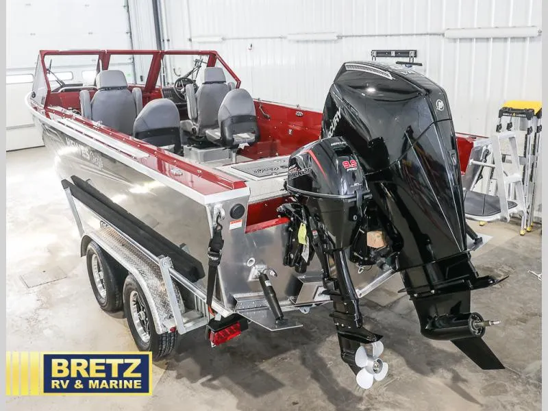 Slide: The Image of 2025 Evolution 221 boat with dual outboard motors in a showroom. - 26
