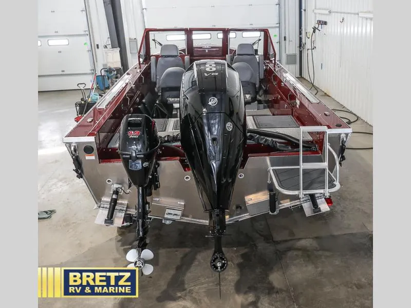 Slide: The Image of 2025 Evolution 221 boat with dual outboard motors in a showroom. - 27