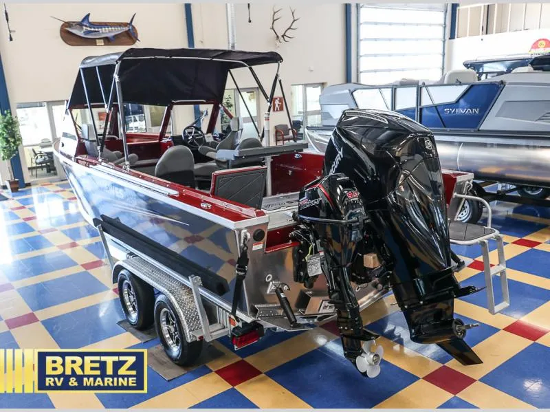 Slide: The Image of 2025 Evolution 221 boat with outboard motor at Bretz RV & Marine showroom. - 4