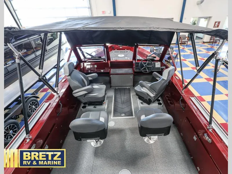 Slide: The Image of Interior of 2025 Evolution 221 boat with seating and canopy at Bretz RV & Marine. - 9