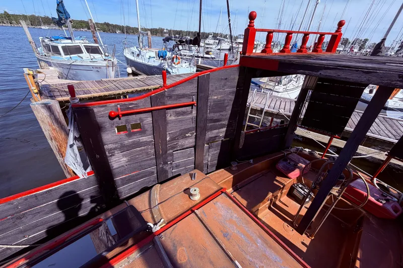 Slide: The Image of Interior of 1982 Watkins 27 Pirate Ship with kitchenette and seating area. - 22