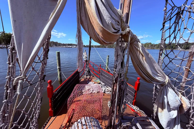 Slide: The Image of Engine compartment of 1982 Watkins 27 Pirate Ship, showing mechanical components and battery. - 31