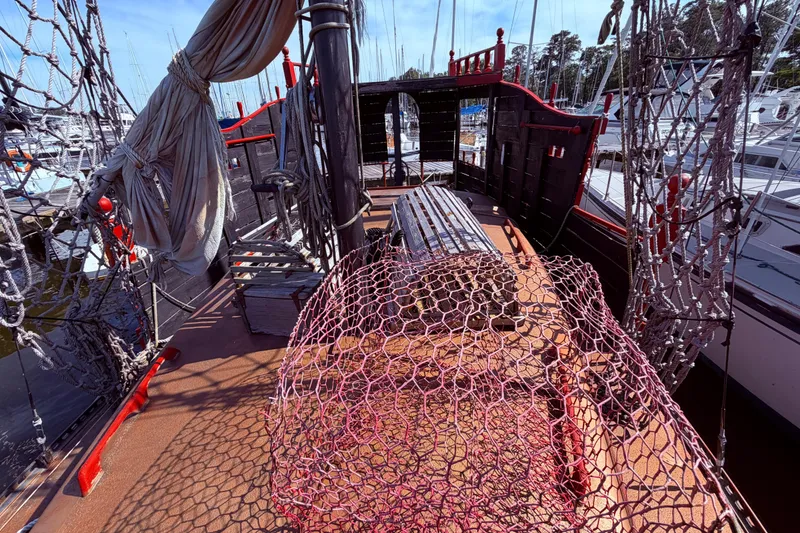 Slide: The Image of Engine compartment of 1982 Watkins 27 Pirate Ship with visible battery and components. - 32