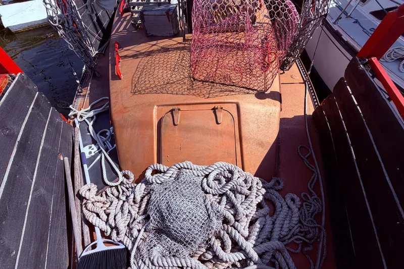 Slide: The Image of Deck of 1982 Watkins 27 Pirate Ship with ropes and fishing net. - 39