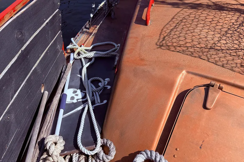 Slide: The Image of 1982 Watkins 27 Pirate Ship deck with ropes and skull design. - 40