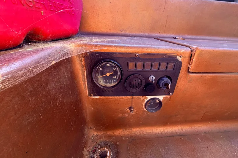 Slide: The Image of Control panel of a 1982 Watkins 27 Pirate Ship with gauge and switches. - 42