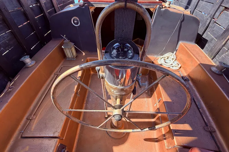 Slide: The Image of Rustic helm of 1982 Watkins 27 Pirate Ship with vintage steering wheel and compass. - 43