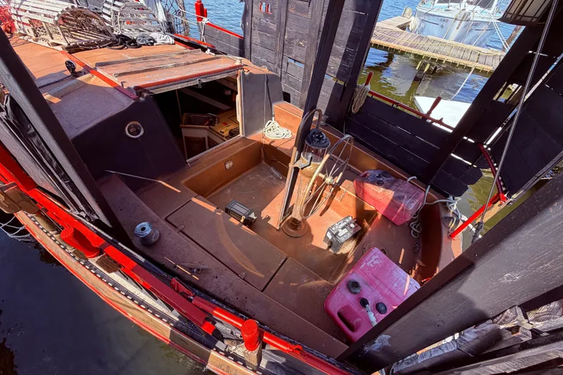 Slide: The Image of 1982 Watkins 27 Pirate Ship interior with nautical equipment and dock view. - 47