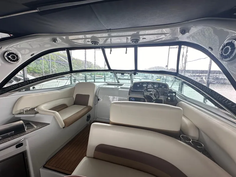 Slide: The Image of Interior of 2020 Crownline 330 SY yacht with modern seating and dashboard. - 12