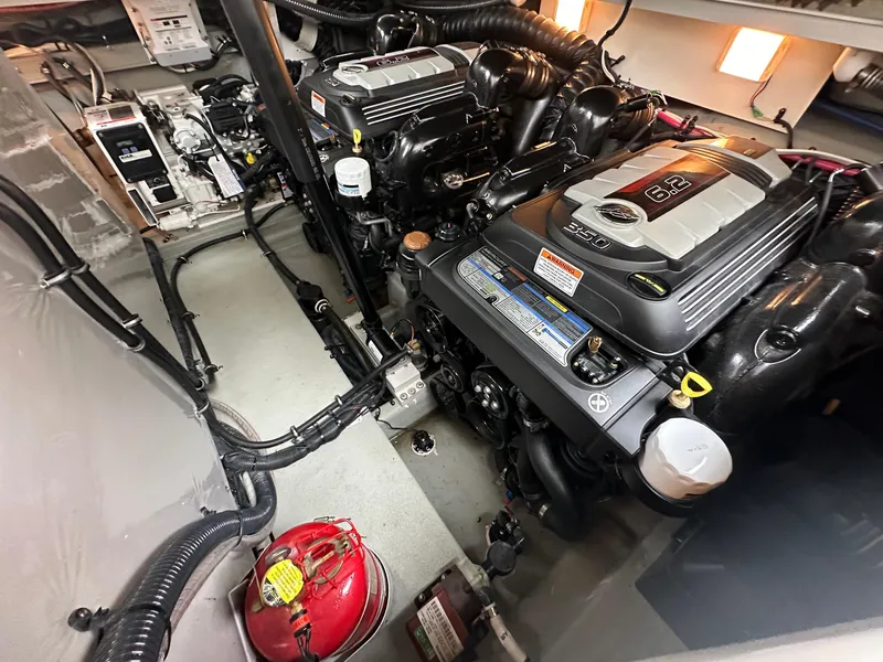 Slide: The Image of Engine room of 2020 Crownline 330 SY boat with dual engines and equipment. - 16