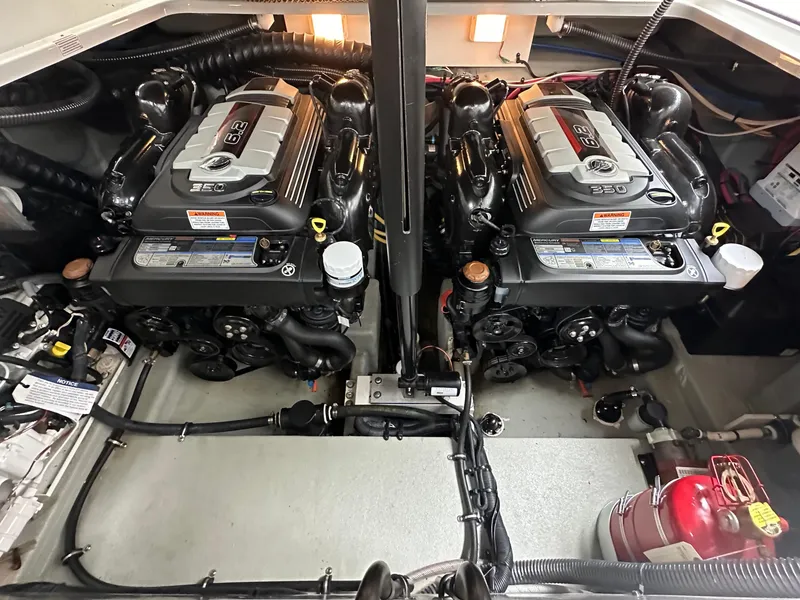 Slide: The Image of Twin engines in a 2020 Crownline 330 SY boat engine room. - 17