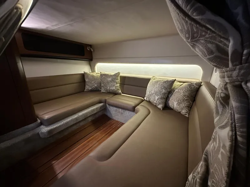 Slide: The Image of Luxurious interior of 2020 Crownline 330 SY yacht with plush seating and cushions. - 19