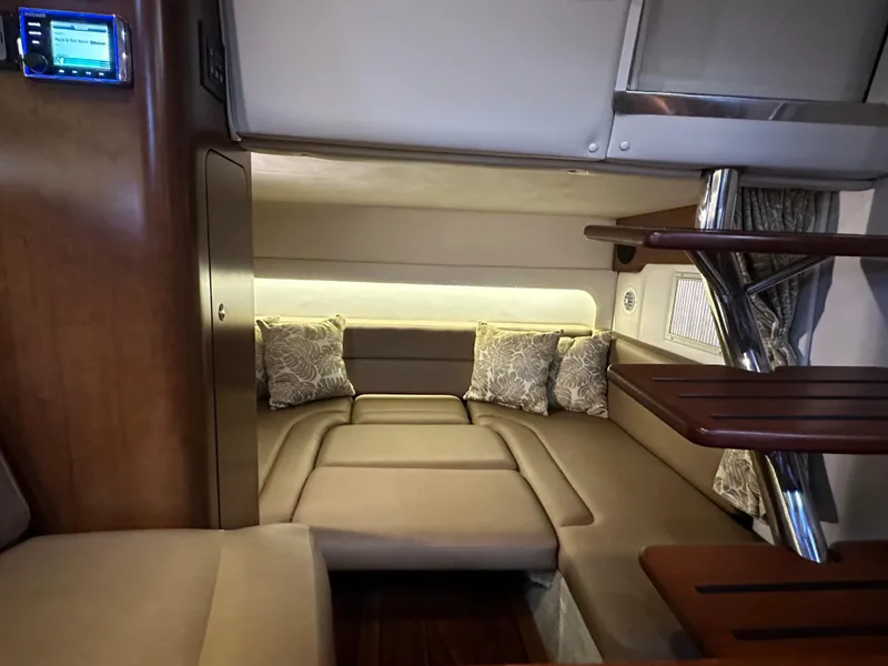 Slide: The Image of Interior of 2020 Crownline 330 SY yacht with cozy seating and modern design. - 20