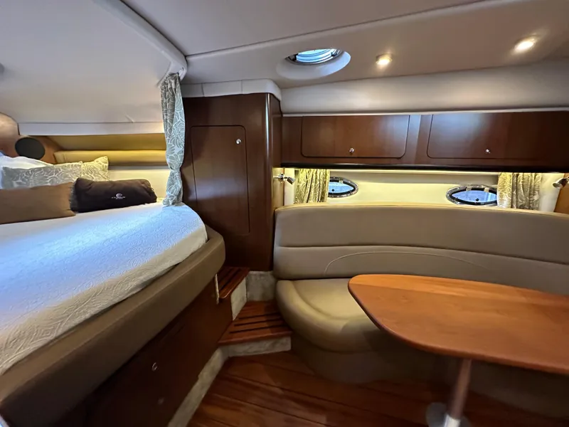 Slide: The Image of Luxurious interior of 2020 Crownline 330 SY yacht with cozy seating and elegant wood finishes. - 21