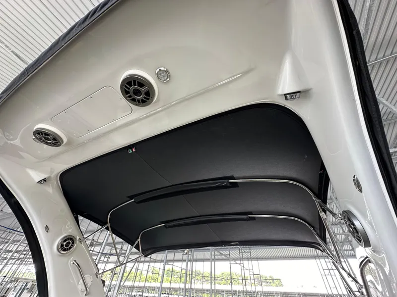 Slide: The Image of Crownline 330 SY 2020 boat canopy with speakers and sleek design. - 25