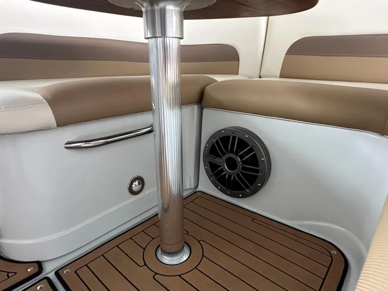 Slide: The Image of Crownline 330 SY 2020 interior, featuring seating, table, and speaker. - 26