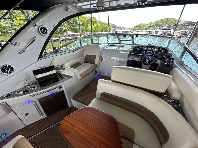 Slide: The Image of Luxurious 2020 Crownline 330 SY yacht interior with plush seating and modern dashboard. - 31
