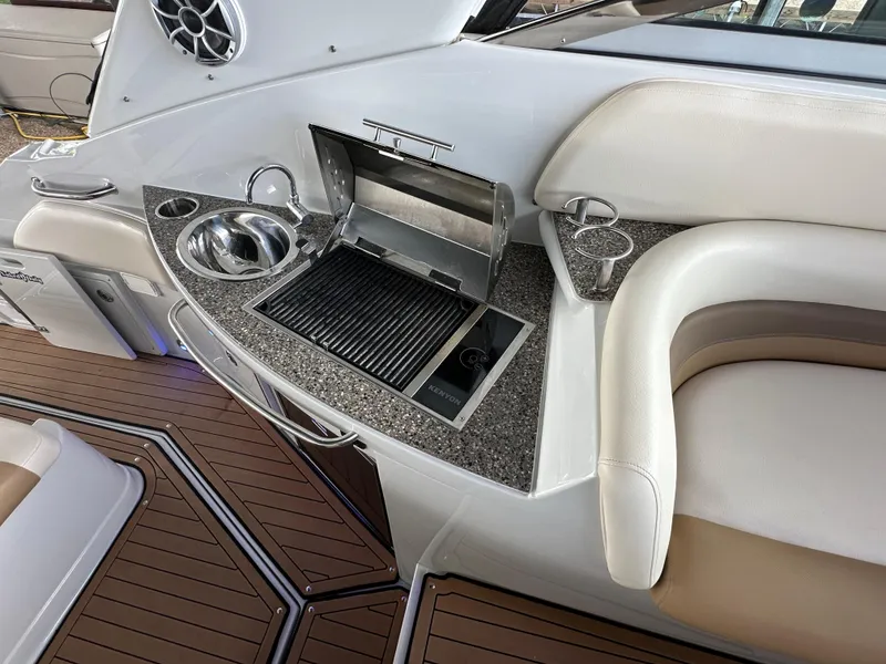Slide: The Image of Luxury Crownline 330 SY 2020 yacht interior with grill and sink. - 35