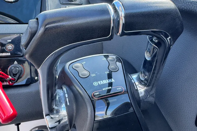 Slide: The Image of Close-up of Yamaha throttle controls on a 2018 Regal 29 OBX boat. - 15