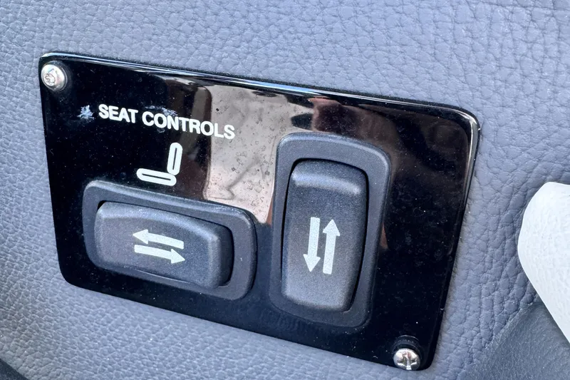 Slide: The Image of 2018 Regal 29 OBX seat controls panel with adjustment buttons. - 19