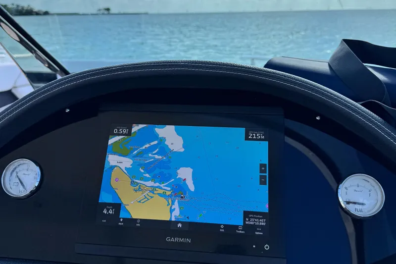Slide: The Image of Garmin navigation system on 2018 Regal 29 OBX boat dashboard with ocean view. - 20