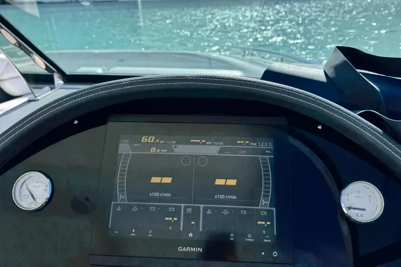 Slide: The Image of Garmin display on 2018 Regal 29 OBX boat dashboard with water view. - 21