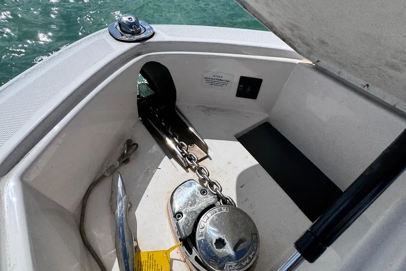 Slide: The Image of Anchor compartment of 2018 Regal 29 OBX boat with chain and winch. - 33