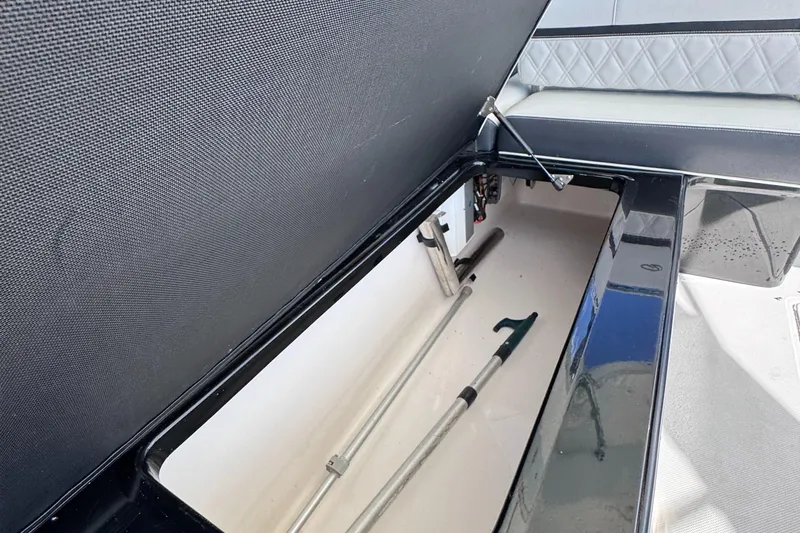 Slide: The Image of Open storage compartment in 2018 Regal 29 OBX boat. - 38