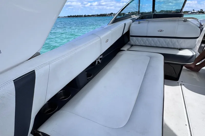 Slide: The Image of 2018 Regal 29 OBX boat interior with white seating and ocean view. - 39