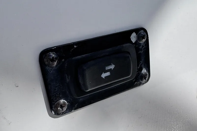 Slide: The Image of Close-up of a 2018 Regal 29 OBX boat switch with directional arrows. - 43