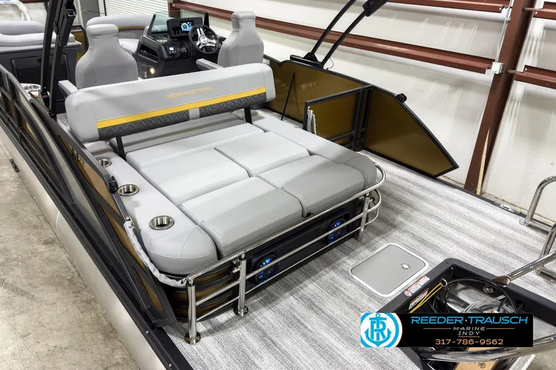 Slide: The Image of 2025 Bennington 22 MSB pontoon boat interior with plush seating and modern dashboard. - 12