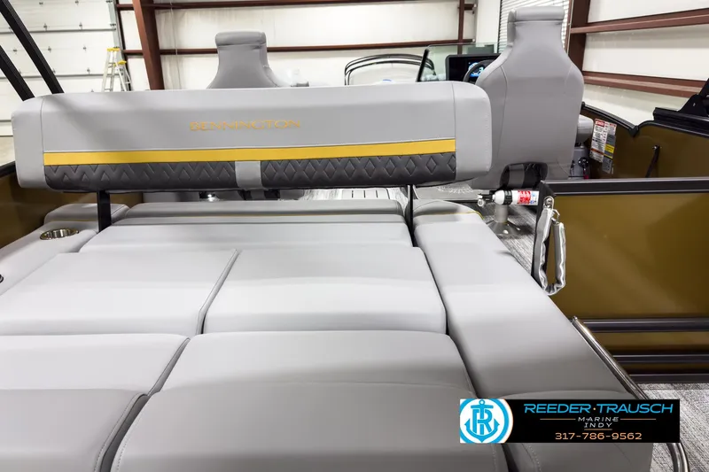 Slide: The Image of 2025 Bennington 22 MSB boat interior with gray seating and Reeder-Trausch logo. - 16